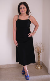 Dress black in imp fabric with pearl details on the strap